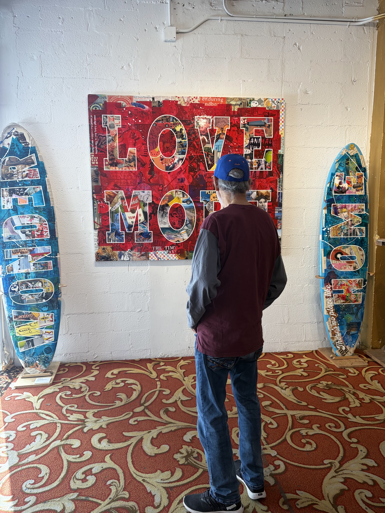 Morris studying a colourful work of art