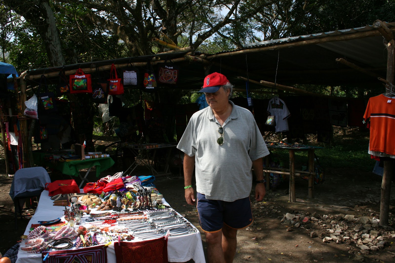 Morris browsing a table of collectibles at a market