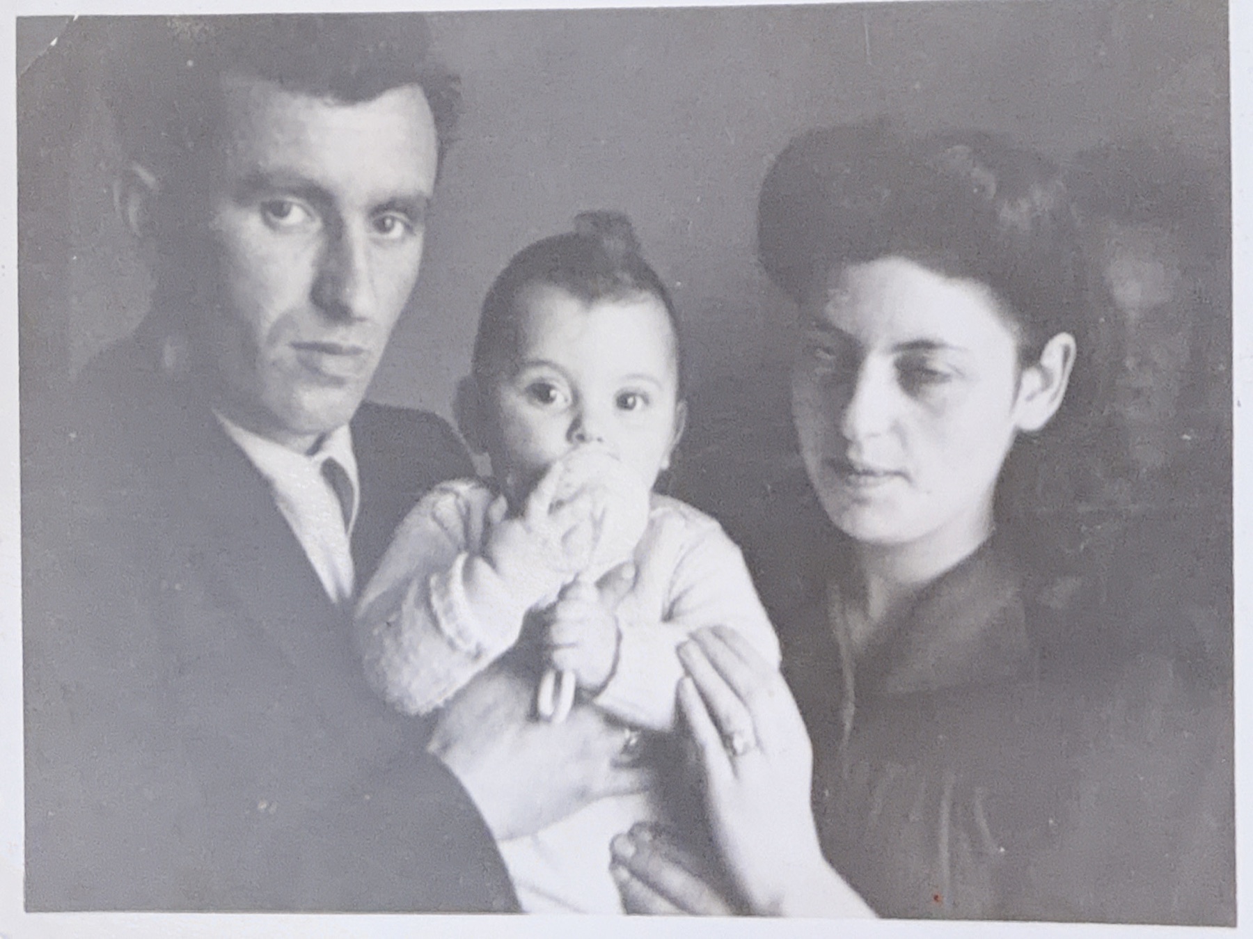 Hejnoch and Jadwiga holding baby Morris in a studio portrait