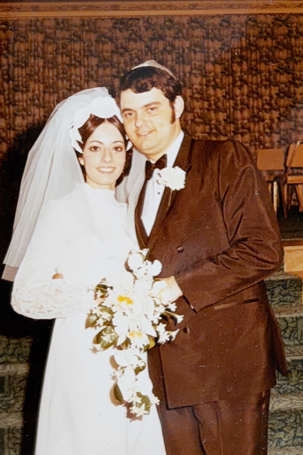 Morris posing with his cousin at her wedding